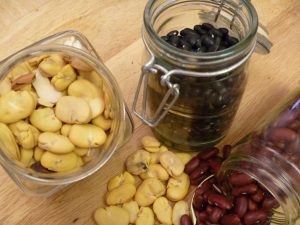 beans spilled on a counter, illustrating the kinds of beans used in cooking.