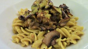 Smoked Coconut Curry Sauce over gluten free fusilli, with roasted and sauteed onions and eggplant. Topped with sauteed mushrooms.